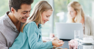Family of father and daughter saving money