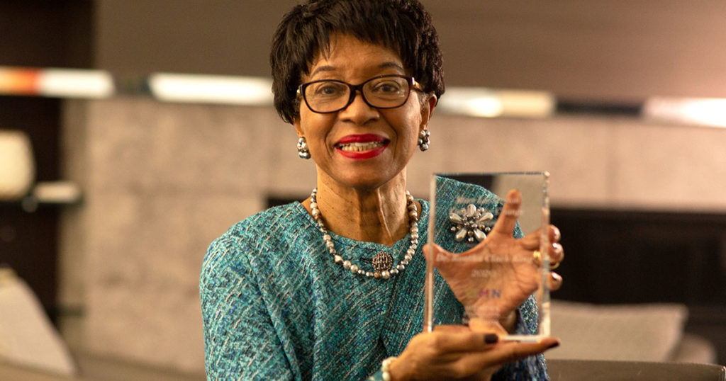 Dr. Reatha Clark King holds her 2020 Mary Lee Dayton Catalyst for Change Award