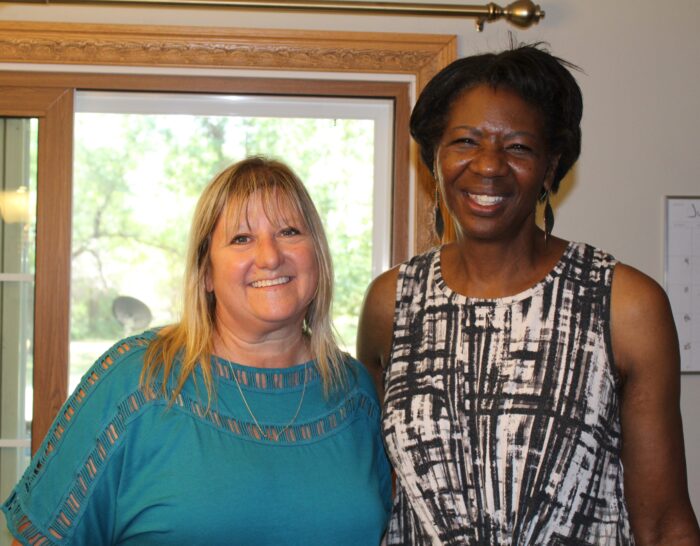 Two Terebinth Refuge staff facing the camera and smiling