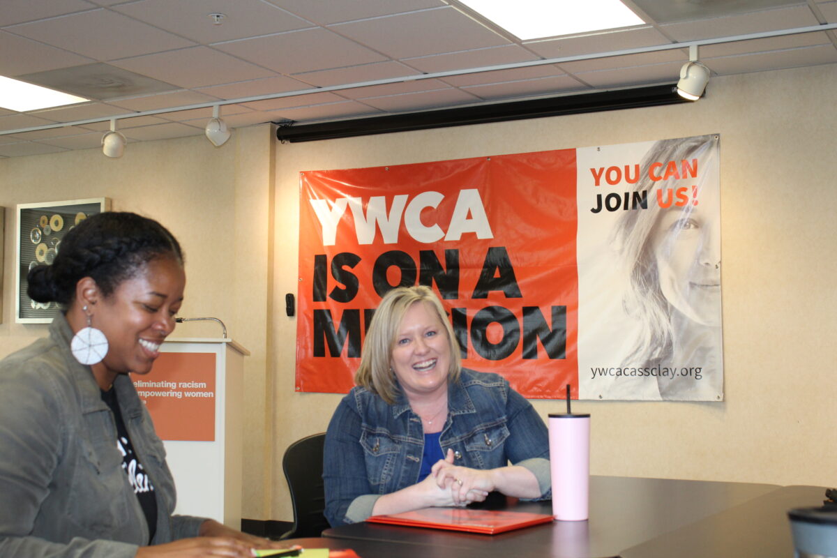 YWCA CEO laughing with LaCora Bradford Kesti from WFM